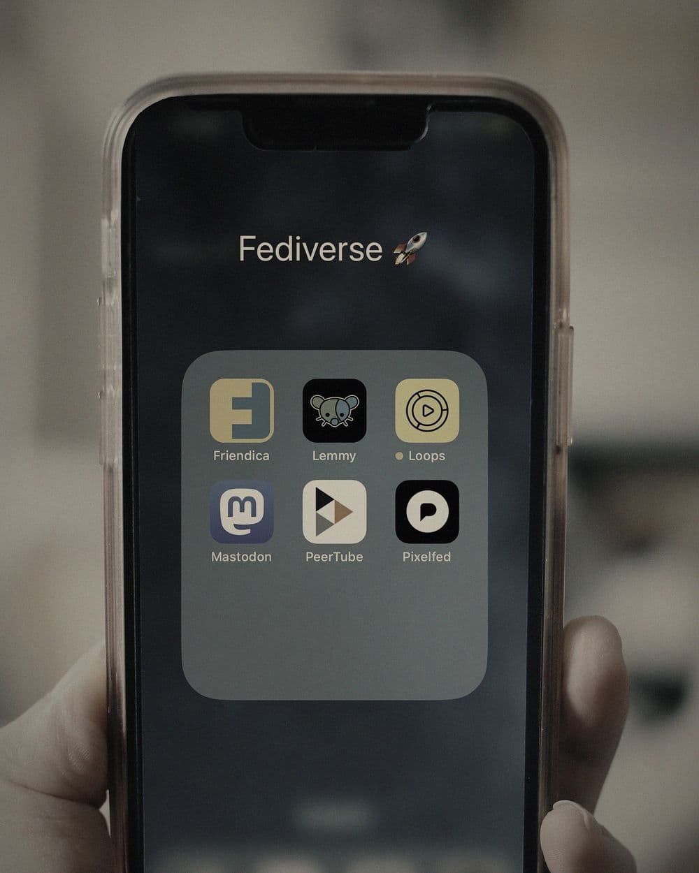 App on a phone, in hand