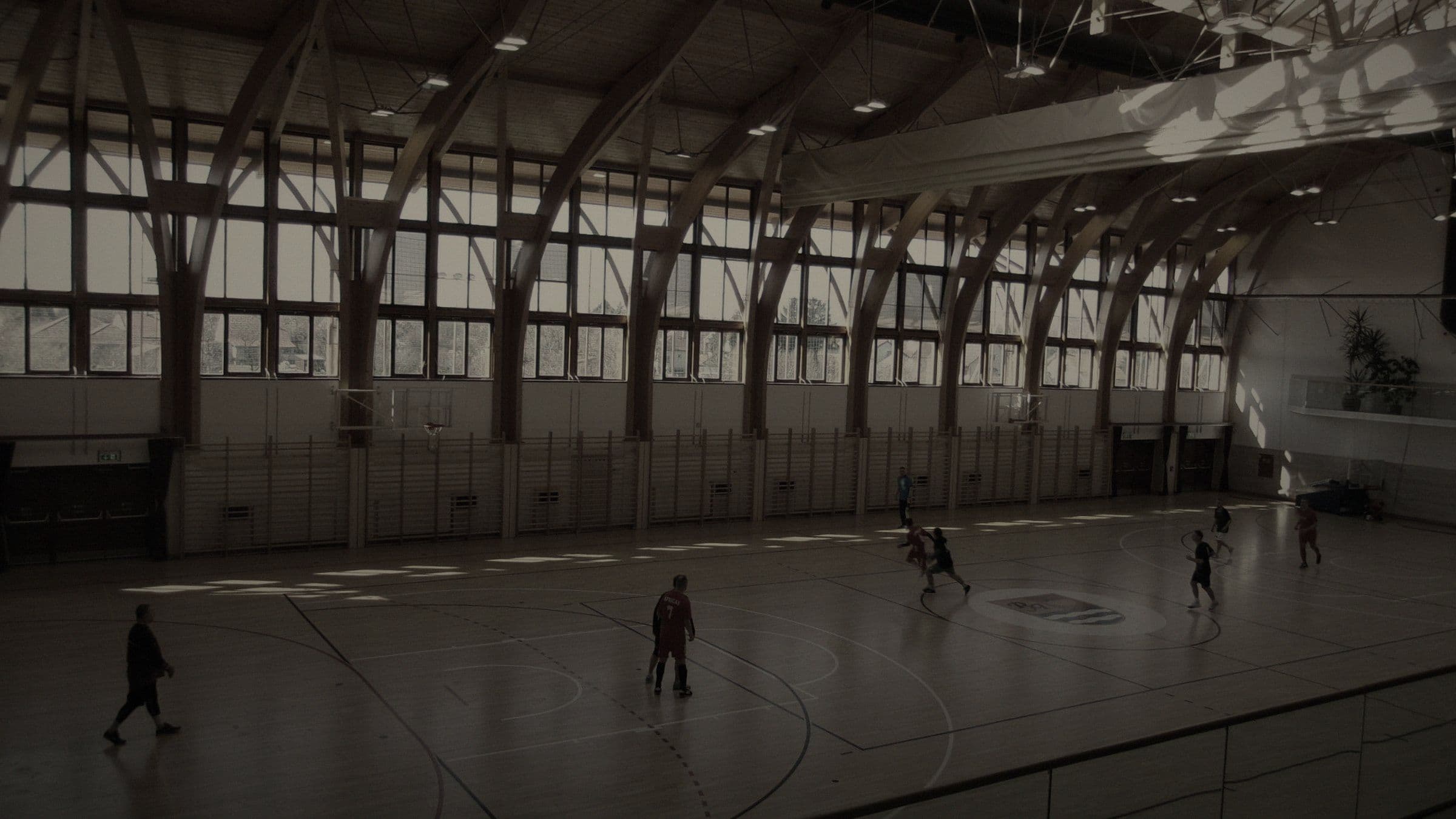 Montage 1 — devs on a badminton court